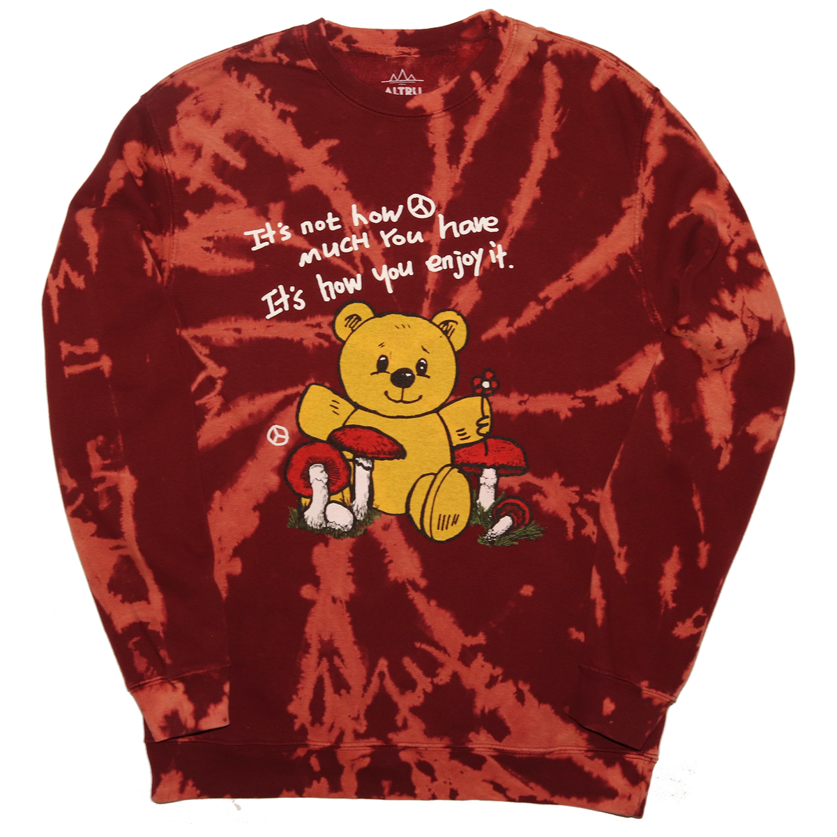 Full front photo of Teddy Bear sitting with mushrooms graphic printed on front of burgundy tie dye fleece fashion sweatshirt. Graphic includes bear, mushrooms, flower, peace sign and the text &quot;It&#39;s not how much you have It&#39;s how you enjoy it&quot;.