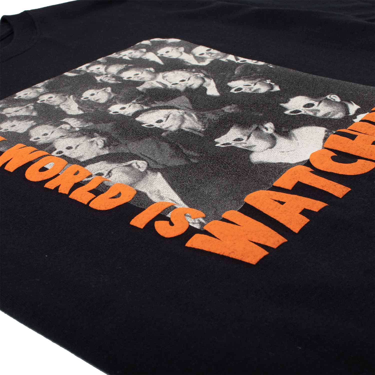 World is Watching Puff Ink Graphic Tee