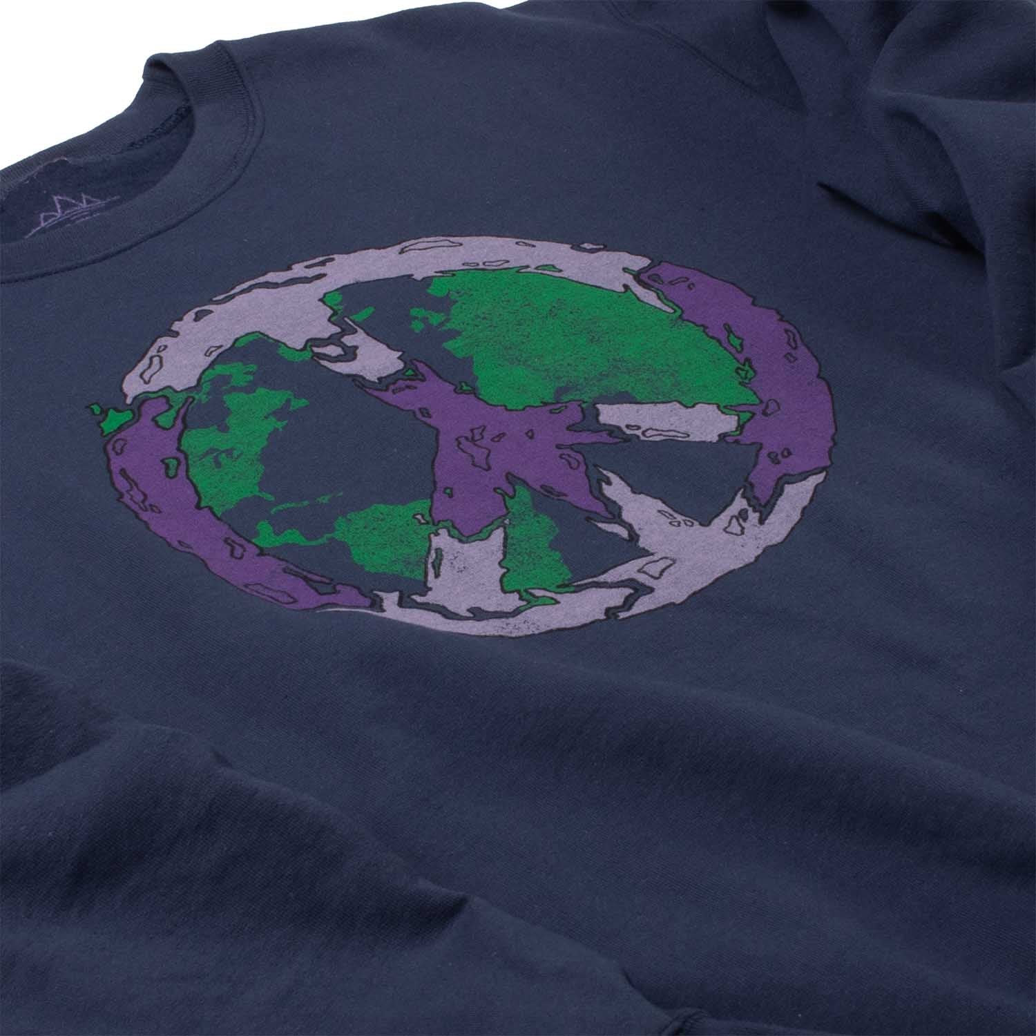 Angled left closeup Photo of sweatshirt chest graphic. Peace vibes fleece sweatshirt of Earth covered with the peace sign. Screen printed graphic on front of comfortable navy-blue super soft fleece.