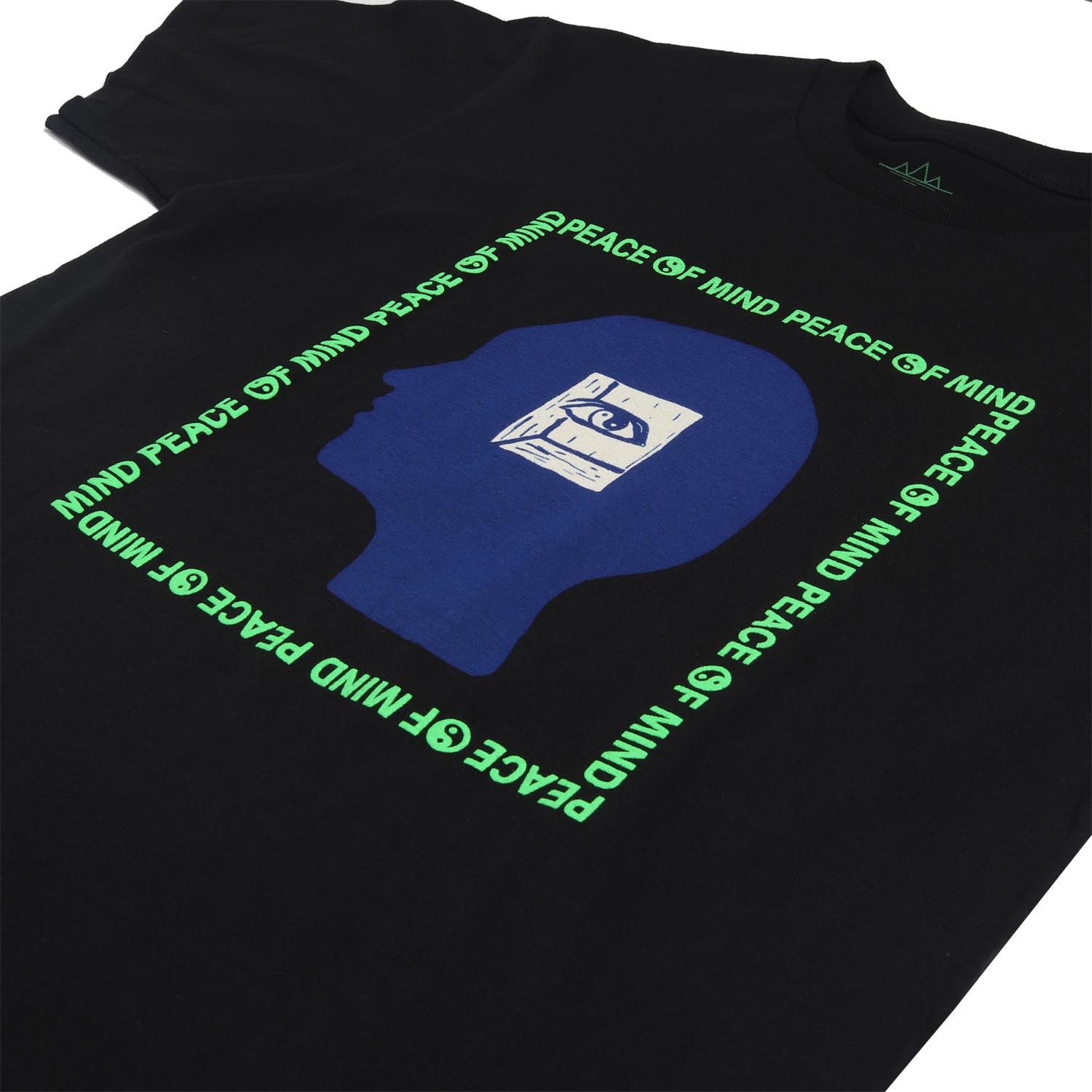 Peace of Mind text on black graphic tee. Yin Yang symbols in green puff ink. Graphic of a head with an inner eye over the head silhouette. graphic. Short sleeve black tee with green puff ink, blue head and white inner eye. 2nd front detail of tee. Altru Apparel.